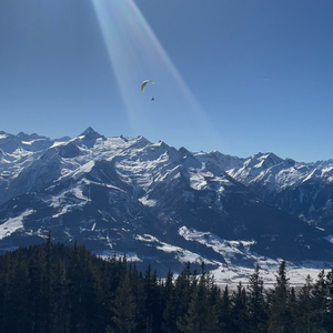 Paraglider flying over Zell am See, Schmittenhöhe